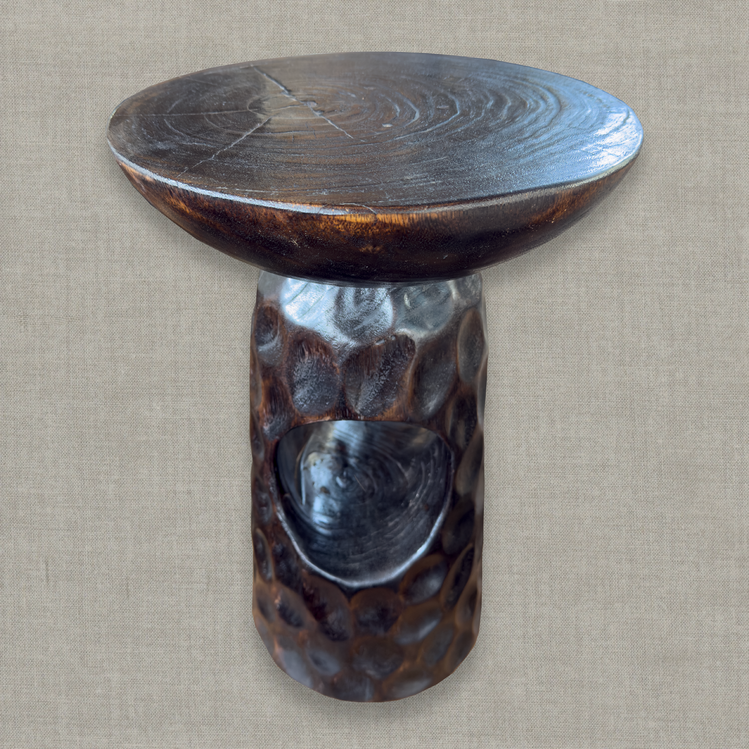 Hand carved solid mango wood sculptural pedestal table in glossy dark brown finish for a modern California living room