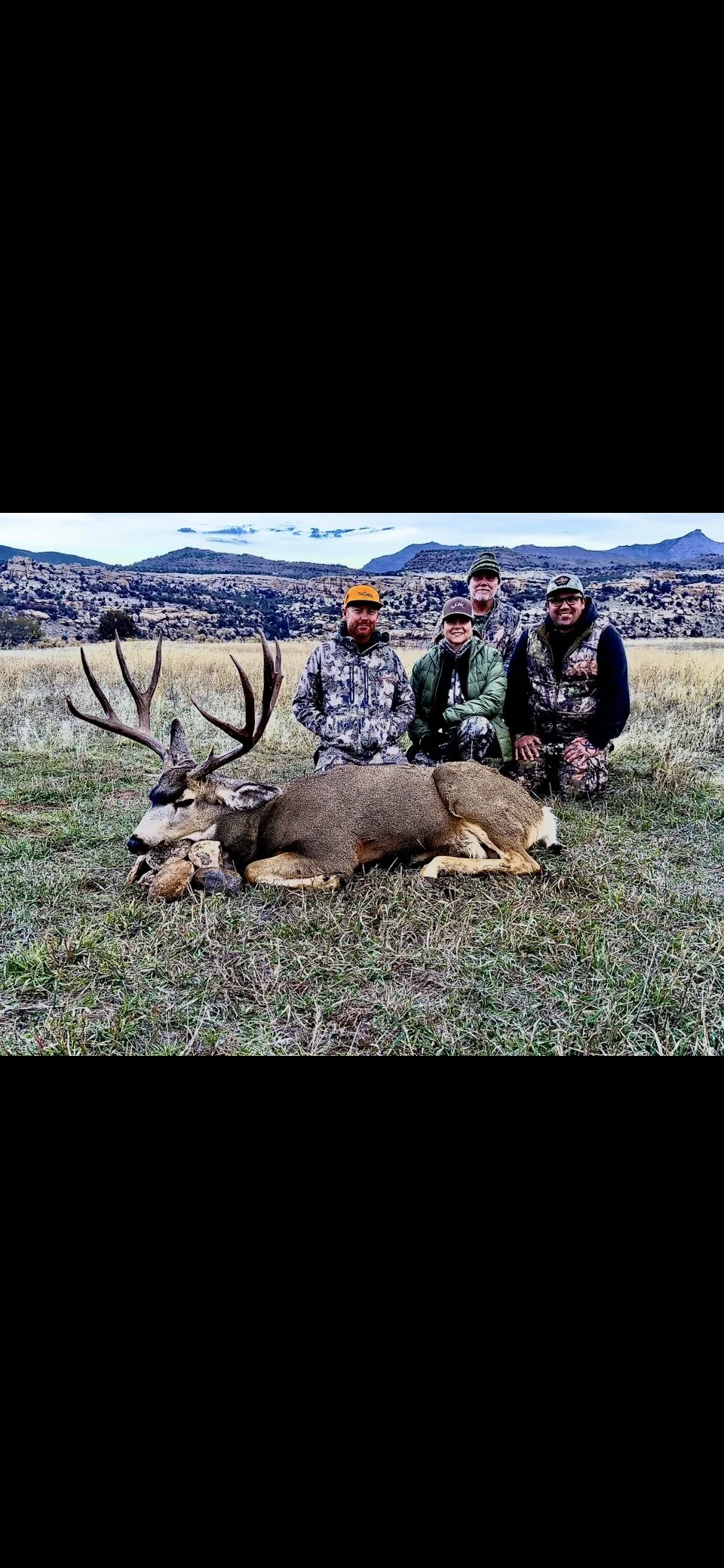 Mule Deer harvest with client and guides