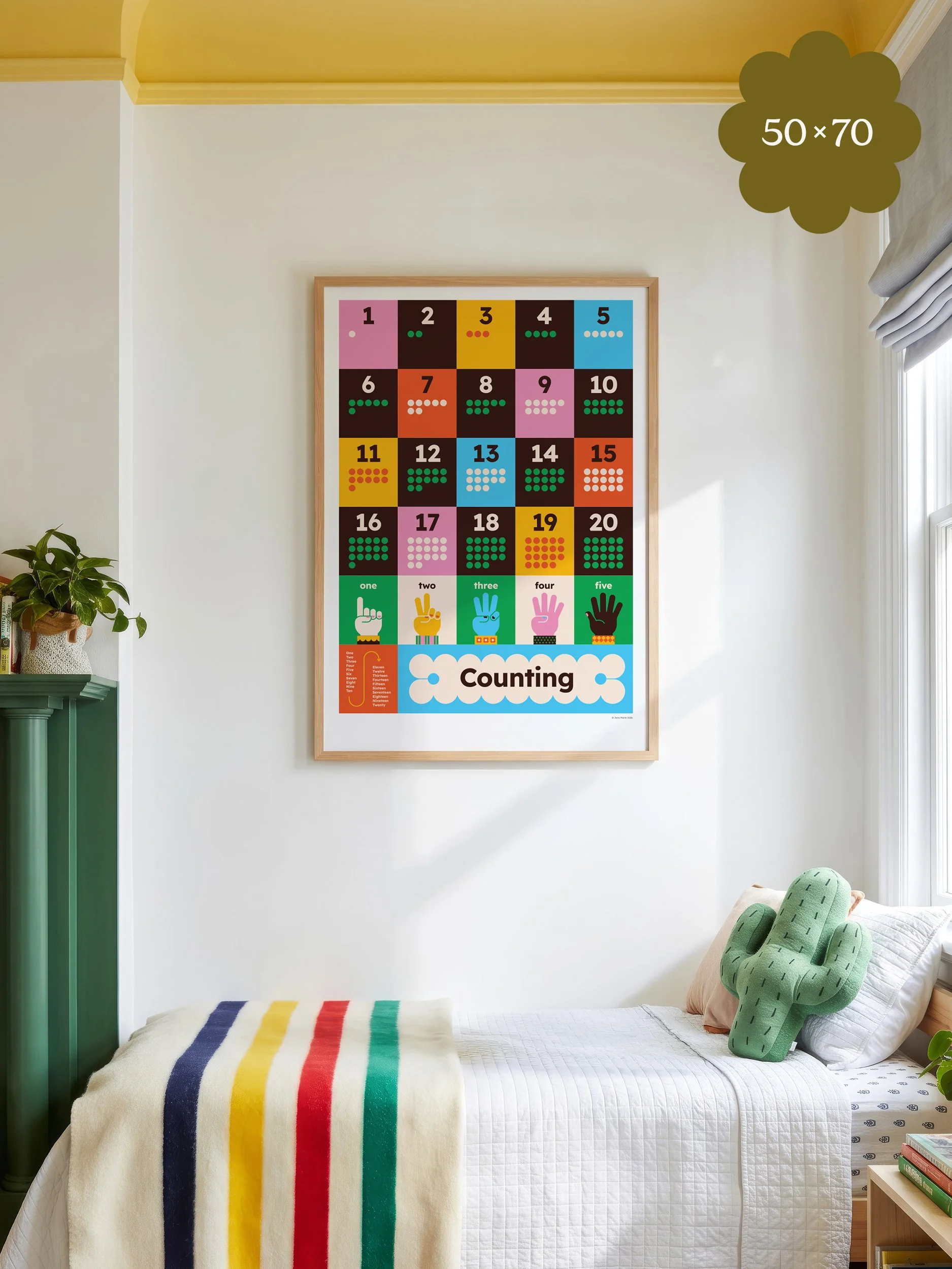 Colourful counting poster with numbers 1 to 20 in oak frame above a child's bed