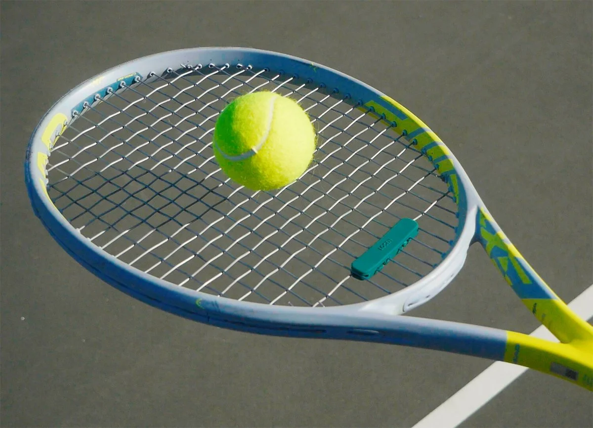 SB_edit_tennis racket dampener_green close up.jpg