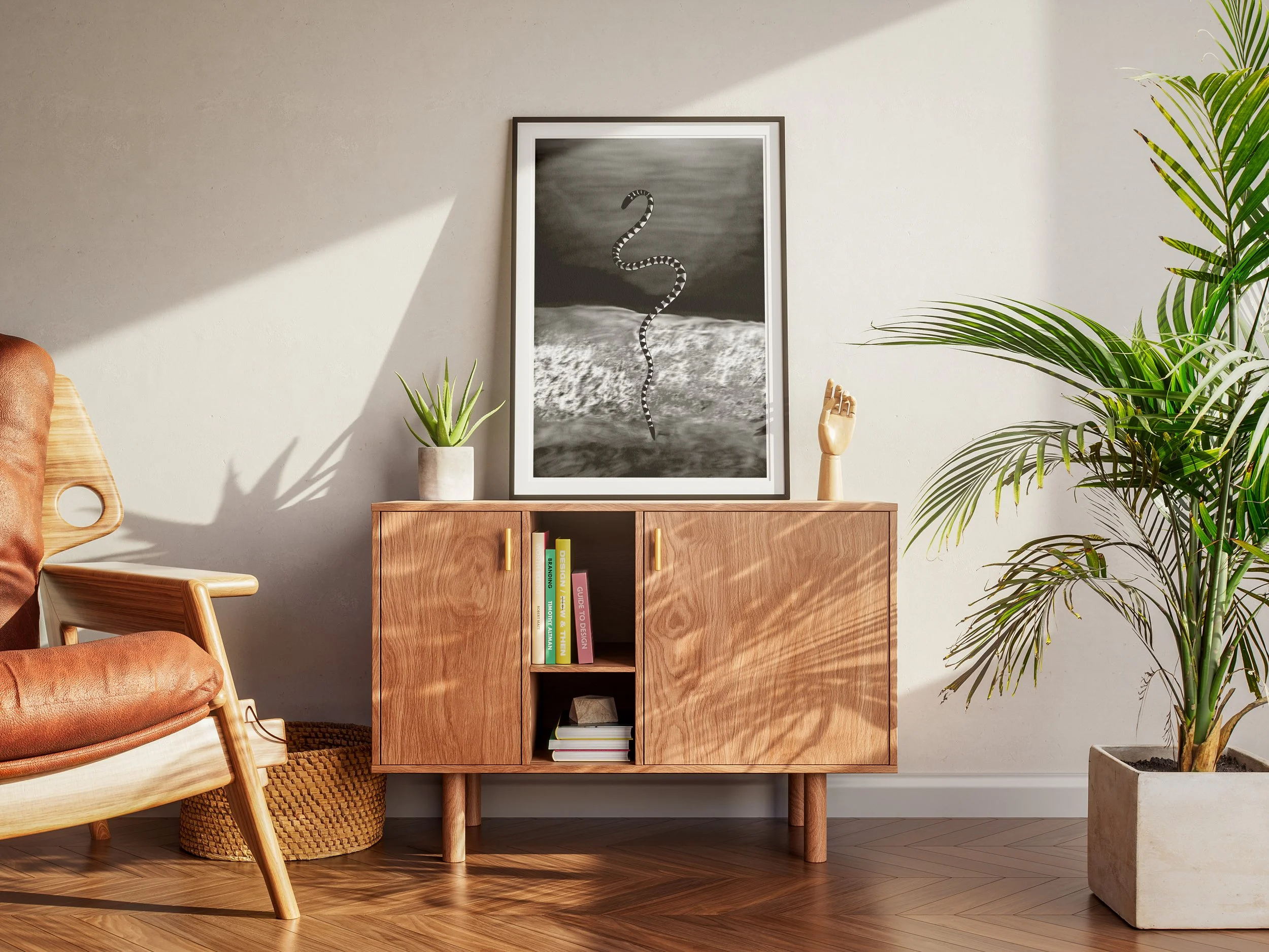 Living room with wooden sideboard, framed black and white art, potted plants, wooden chair with leather cushion, and hardwood floor