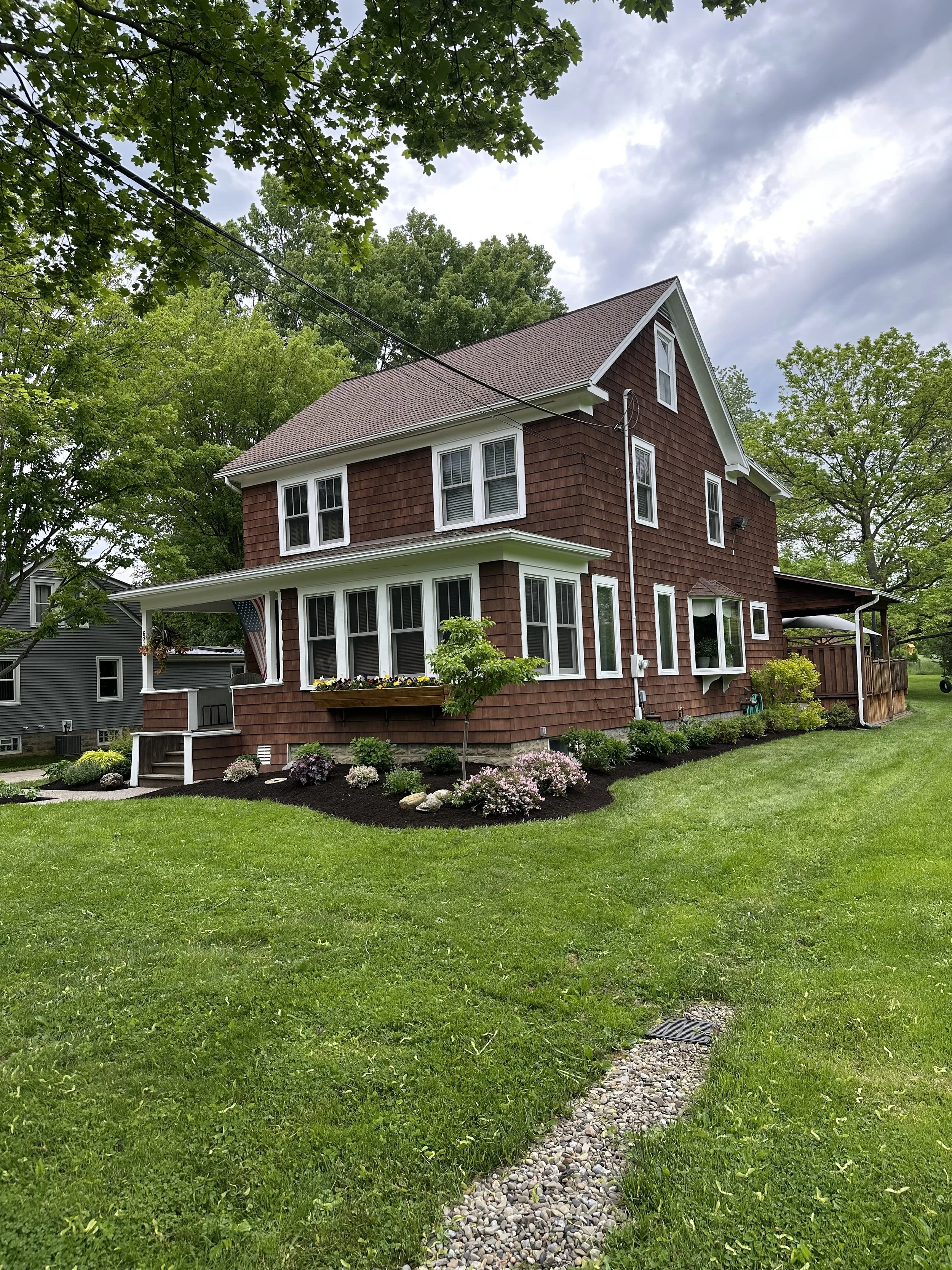 Fresh mulch, trim, weed and edged flower beds