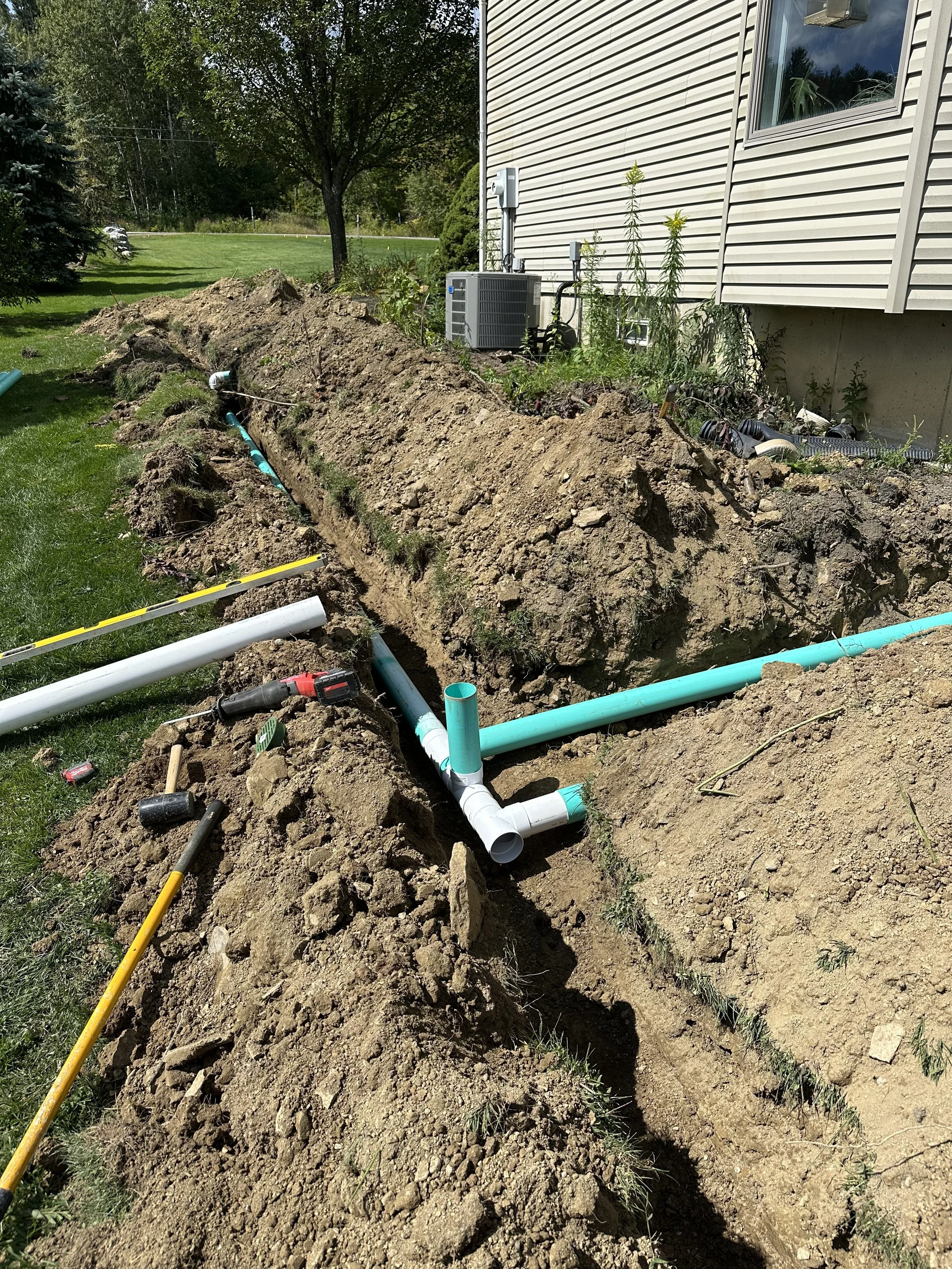 Tied in the downspouts to the drain pipe