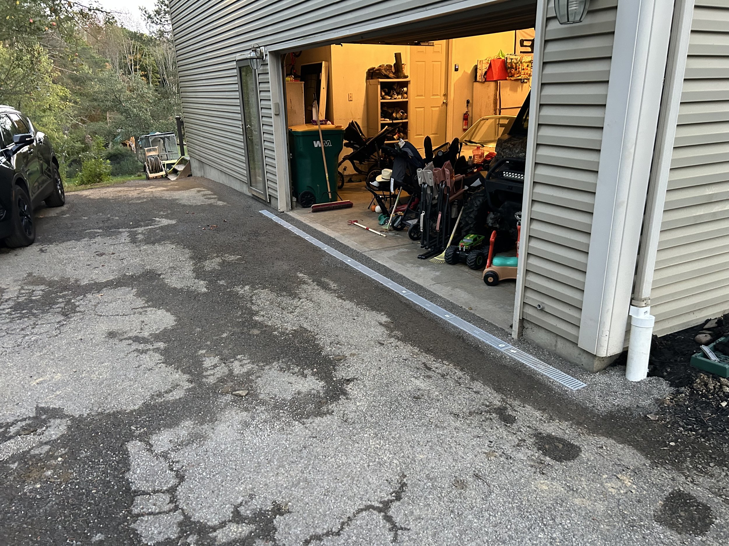 Drainage to prevent water pooli g in garage