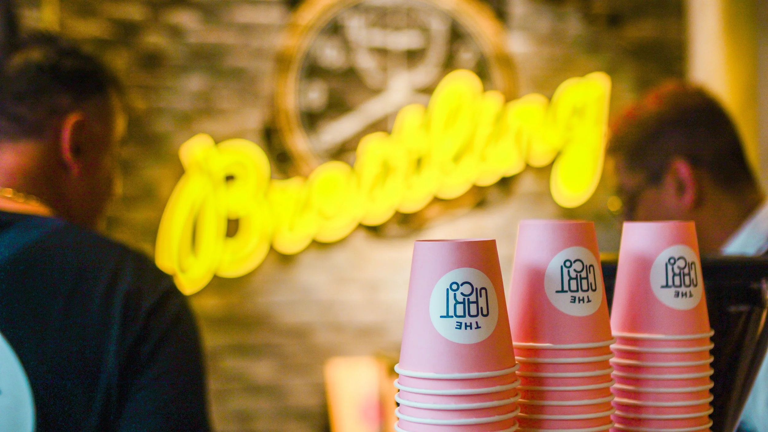 The Cart Co QLD pink takeaway coffee cups at an event