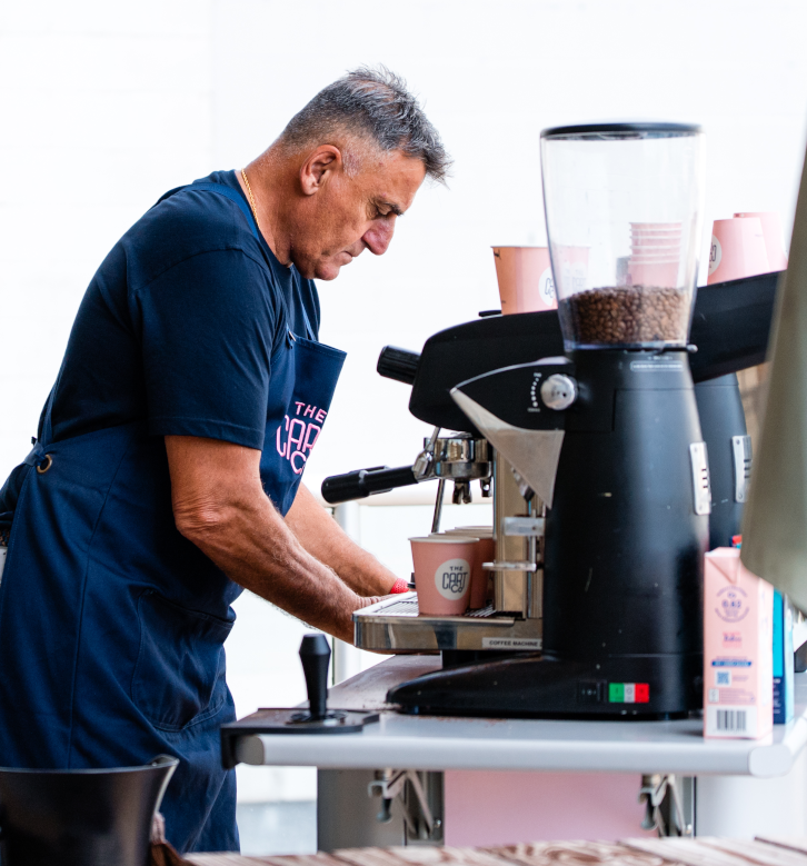 Barista preparing coffee at a mobile event cart on the Gold Coast