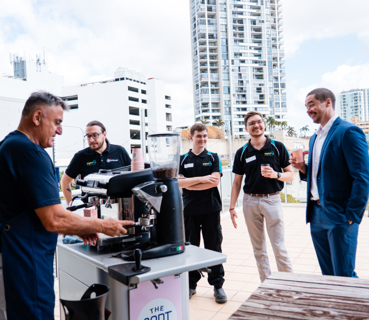 Guests enjoying coffee served from a mobile cart on the Gold Coast