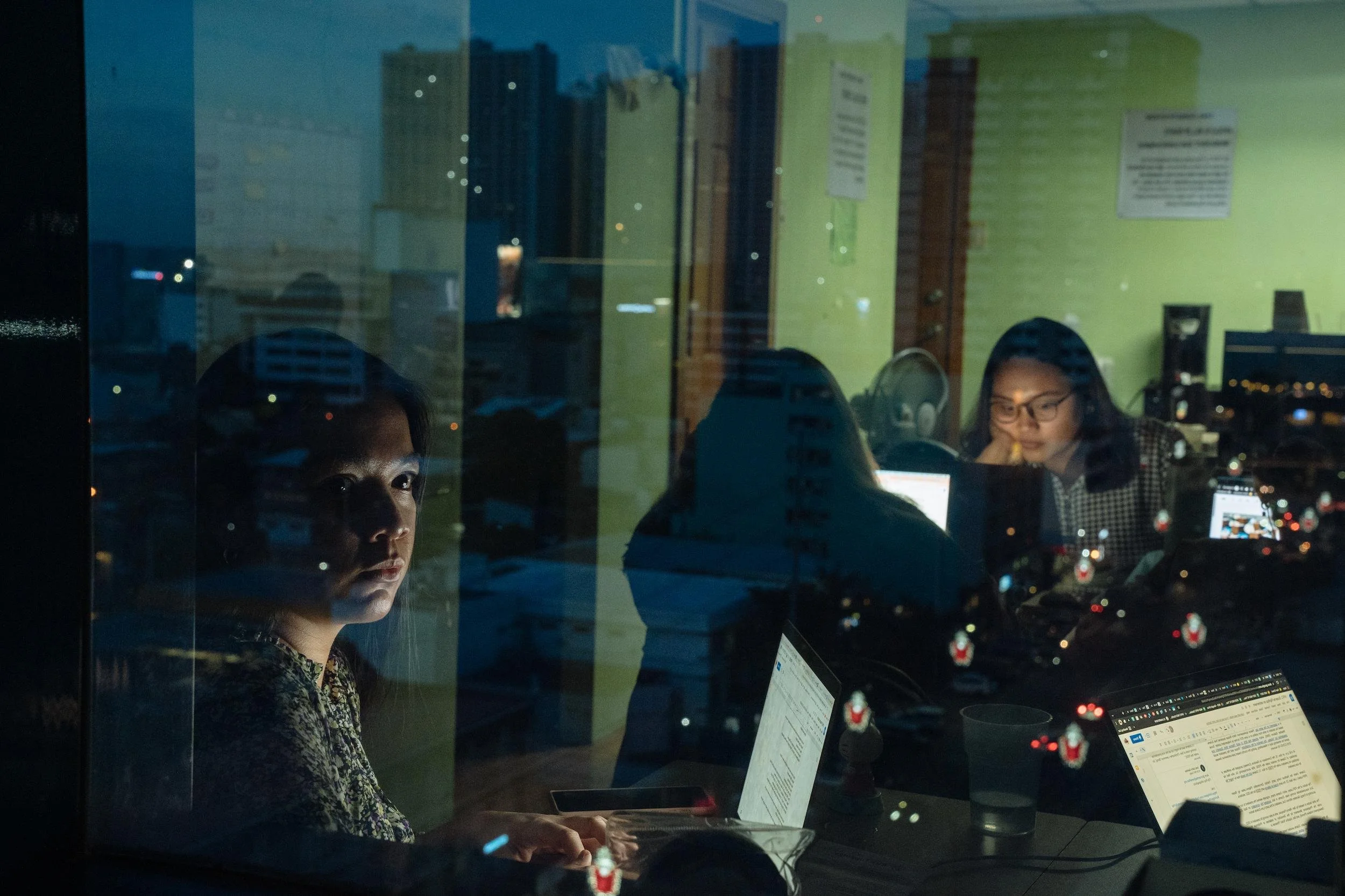 Fact checkers from the Vera Files team, a Facebook fact-checking partner, in their office in Manila. “Lies travel faster than the truth,” says Chin Samson (left). The team see themselves as part of the frontline against disinformation.