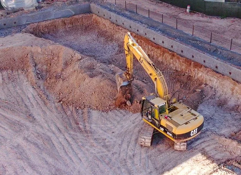 Excavating dirt using a Cat 330 Excavator  in Phoenix, az