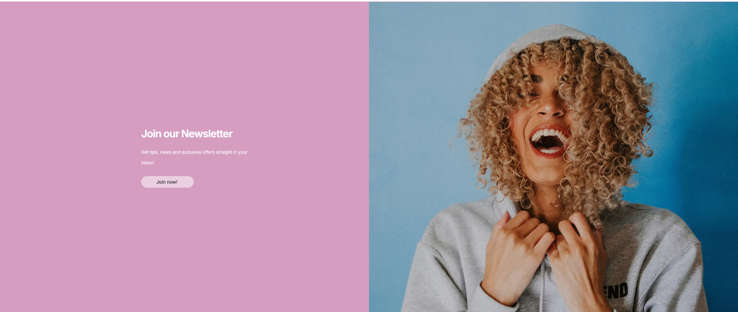 A woman with curly blonde hair, wearing a gray hoodie and a beanie, laughing joyfully against a blue background.