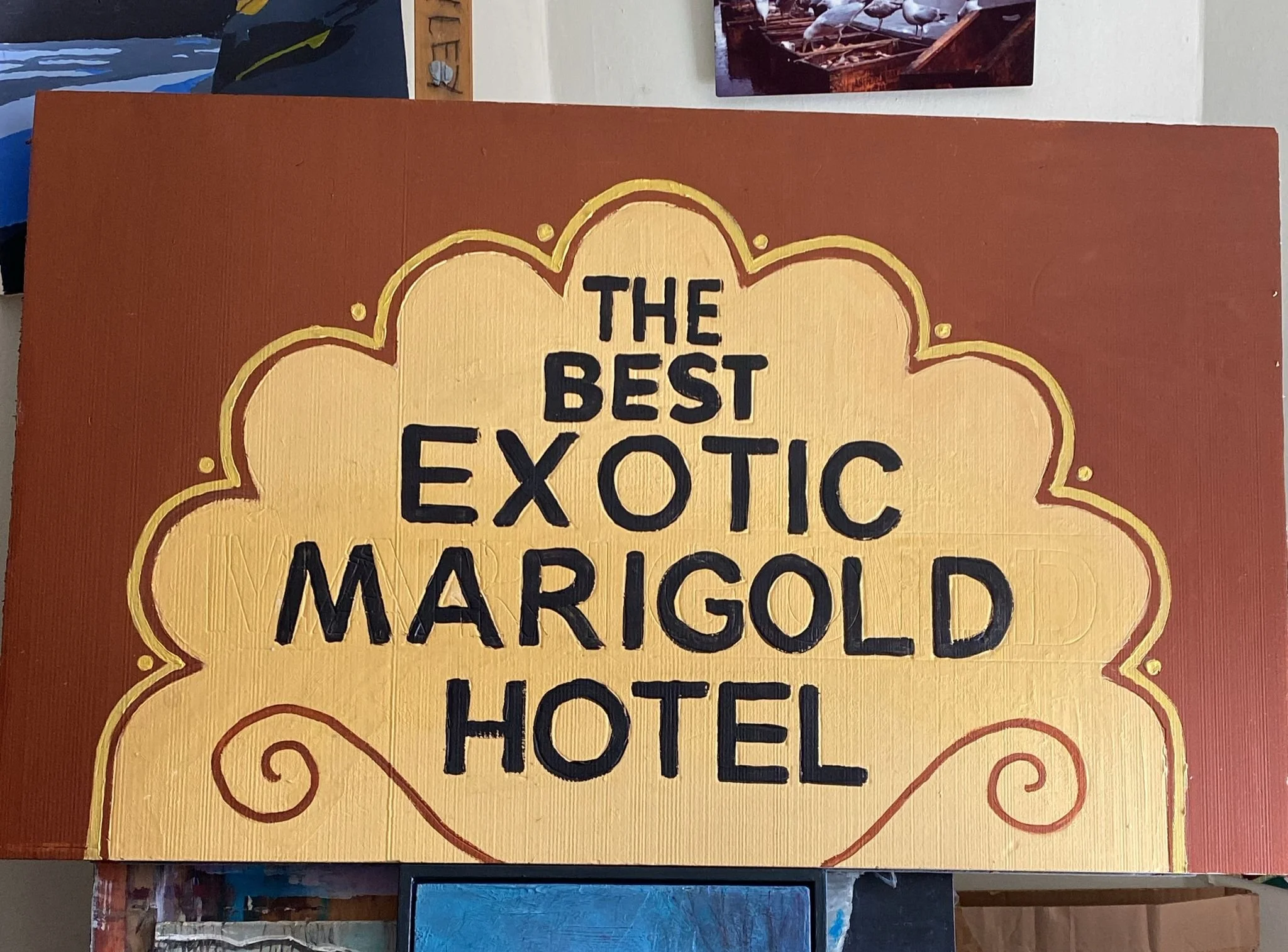 Hand painted sign for Hotel Marigold set