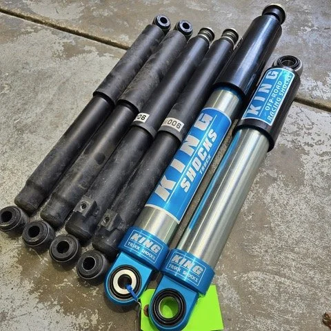 Six shock absorbers, with blue and silver branding