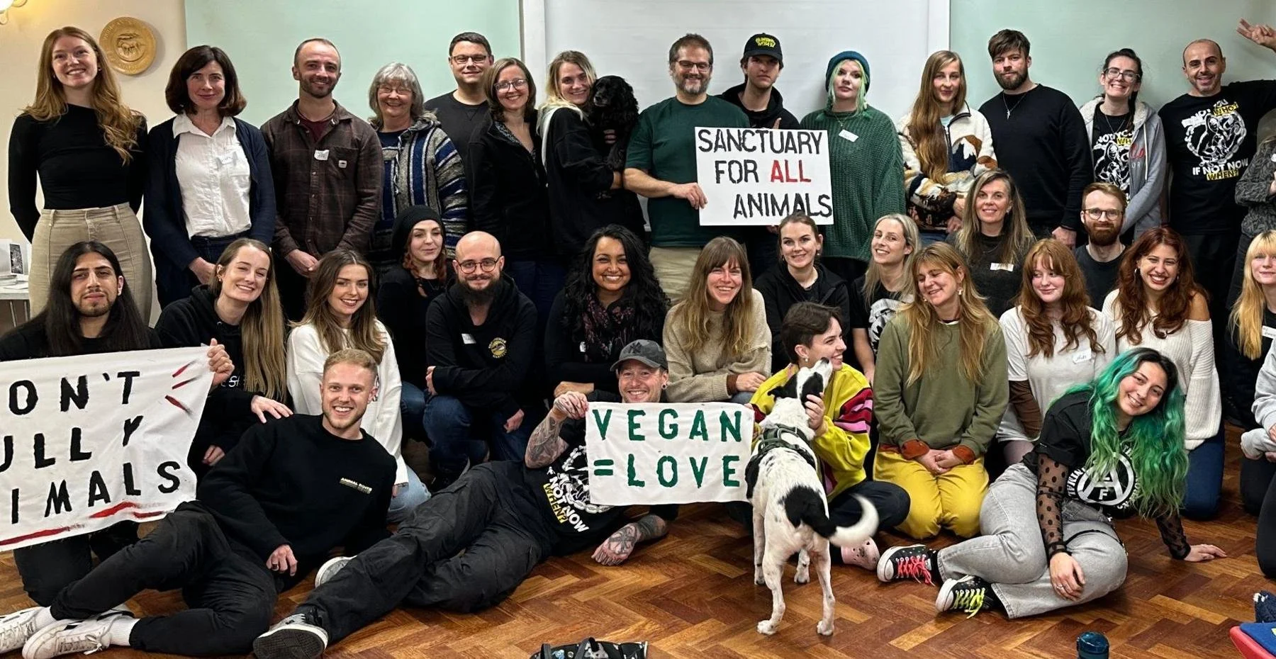 Project Phoenix founders and organisers at the first national gathering, holding Sanctuary for All Animals and Vegan = Love signs
