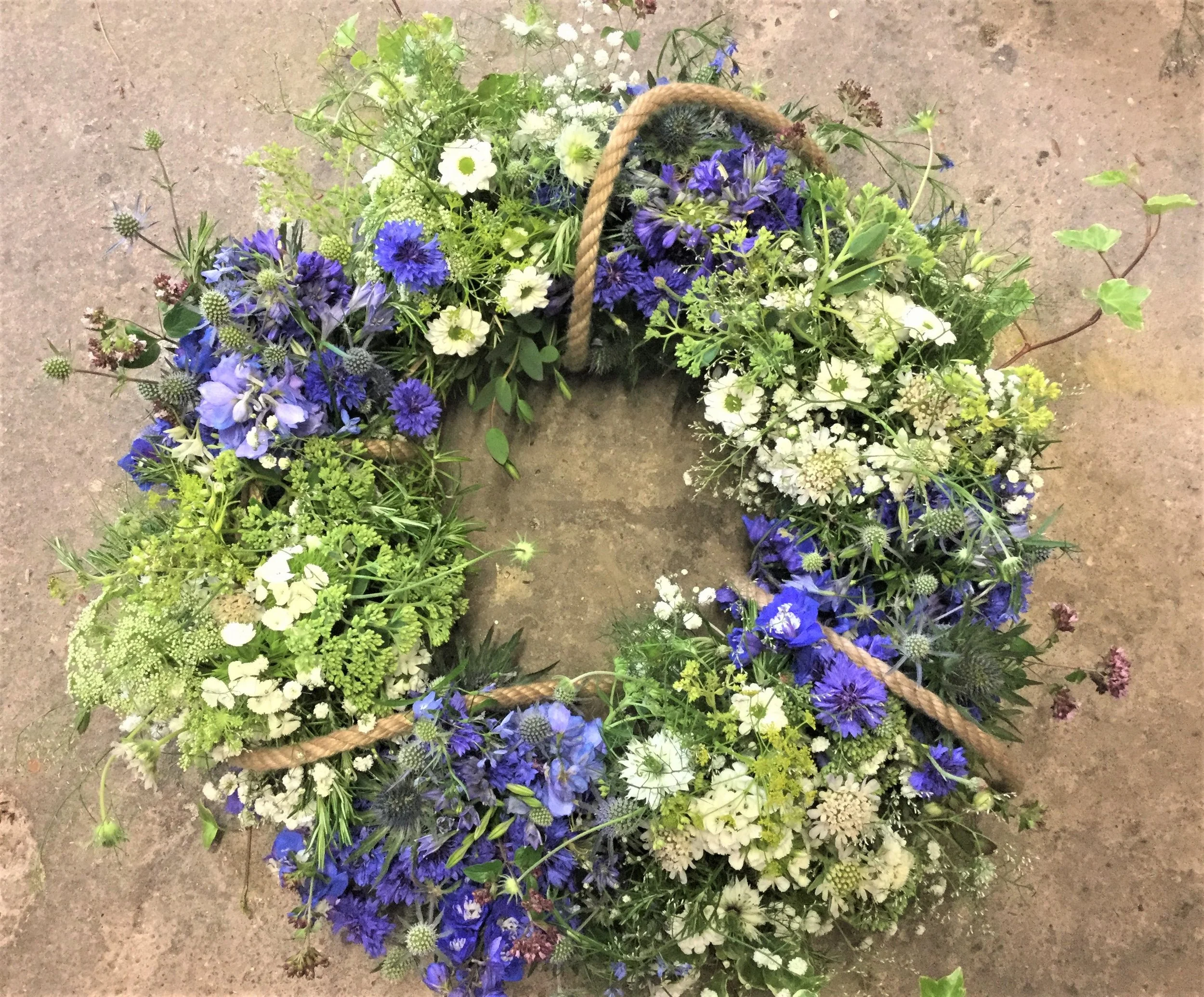 I incorporated sea themed flowers and his own rope to make it look like a buoy. 