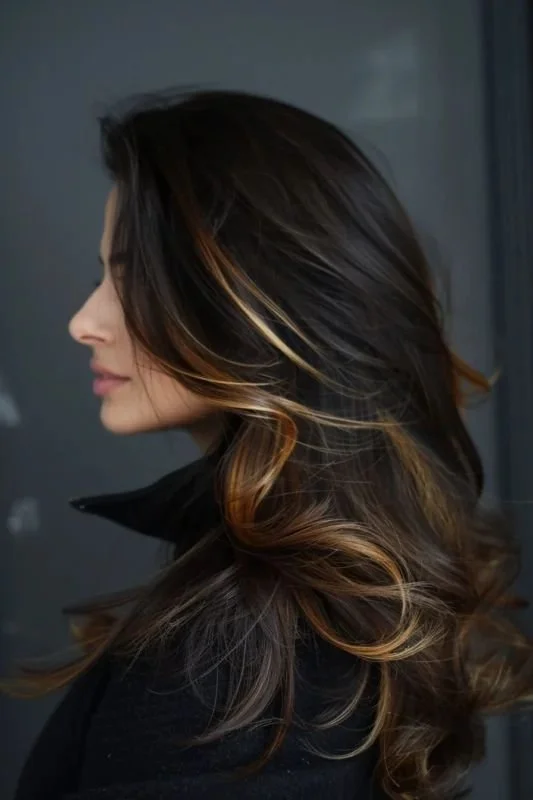 Trending Now: Blending Dark Brown with Subtle Golden Highlights