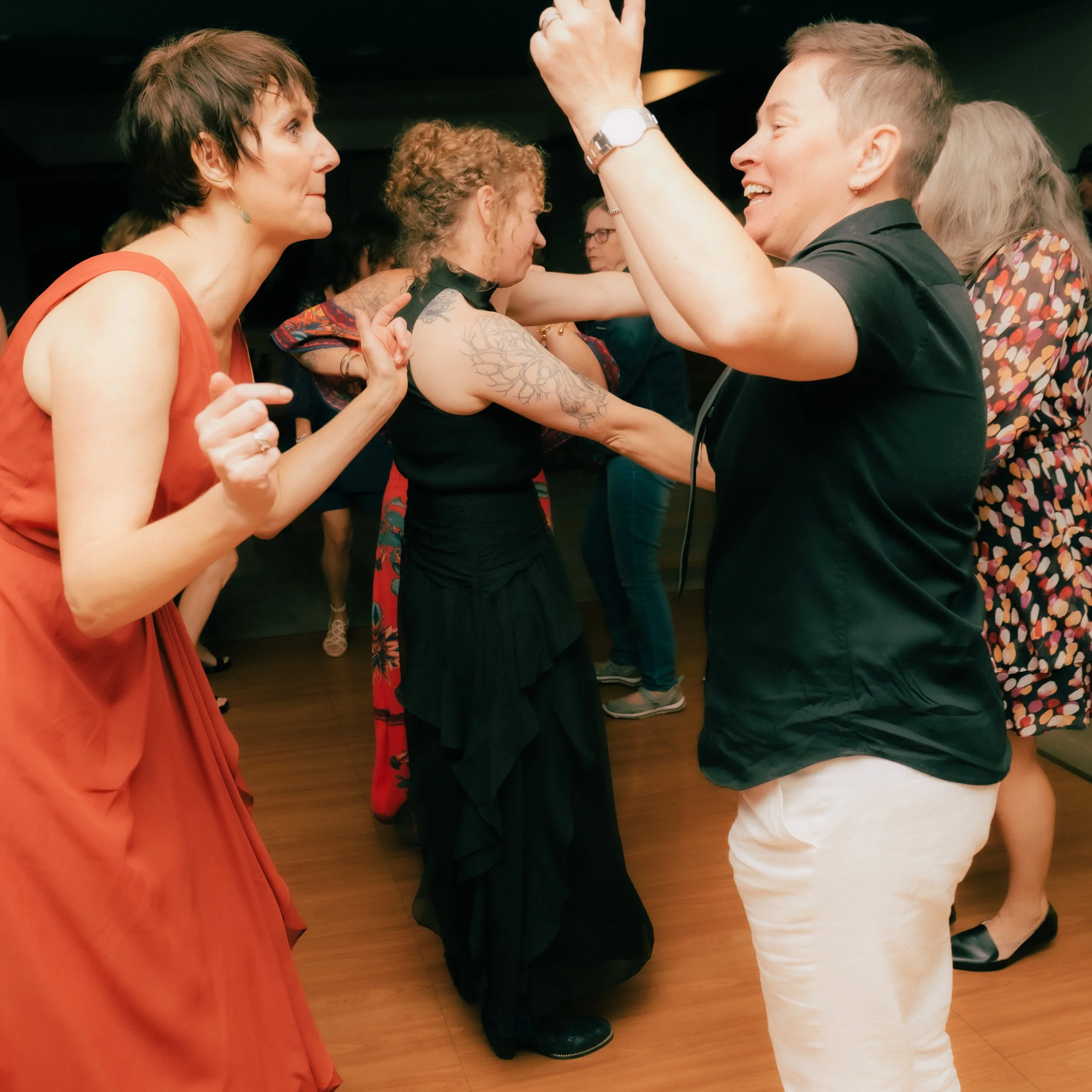 People dancing and enjoying themselves at a party or celebration.