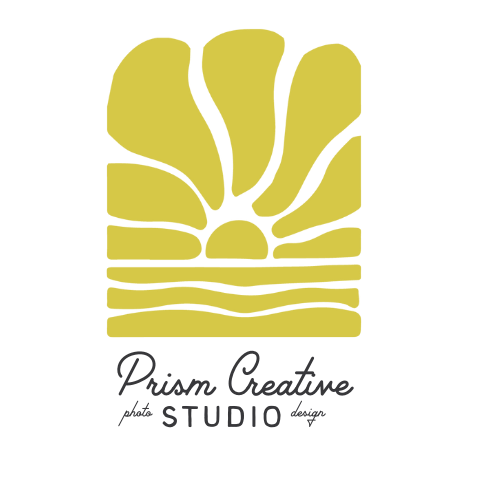 Logo with a stylized sun rising over layered earth or landscape, labeled 'Prism Creative Studio'.