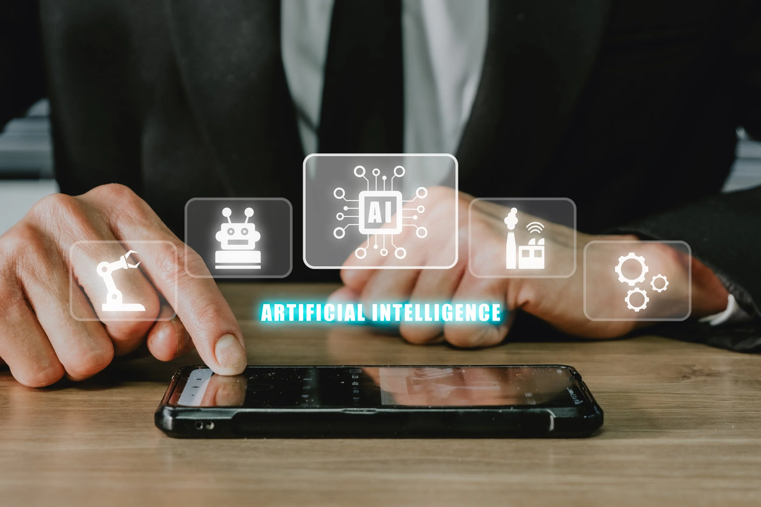 artificial-intelligence-ai-person-using-smartphone-with-holographic-brain-artificial-intelligence-ai-icon-from-screen-internet-things-iot-concept.jpg