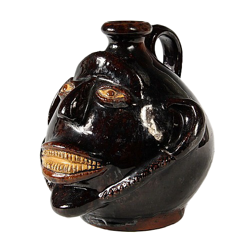 REDWARE FACE JUG - Mid-19th c. Redware Folk Art Face Jug with Albany Slip Glaze, possibly by Stine Pottery, White Cottage, Ohio; dated October 5, 1844. 6 1/2" high, 6 1/4" wide.