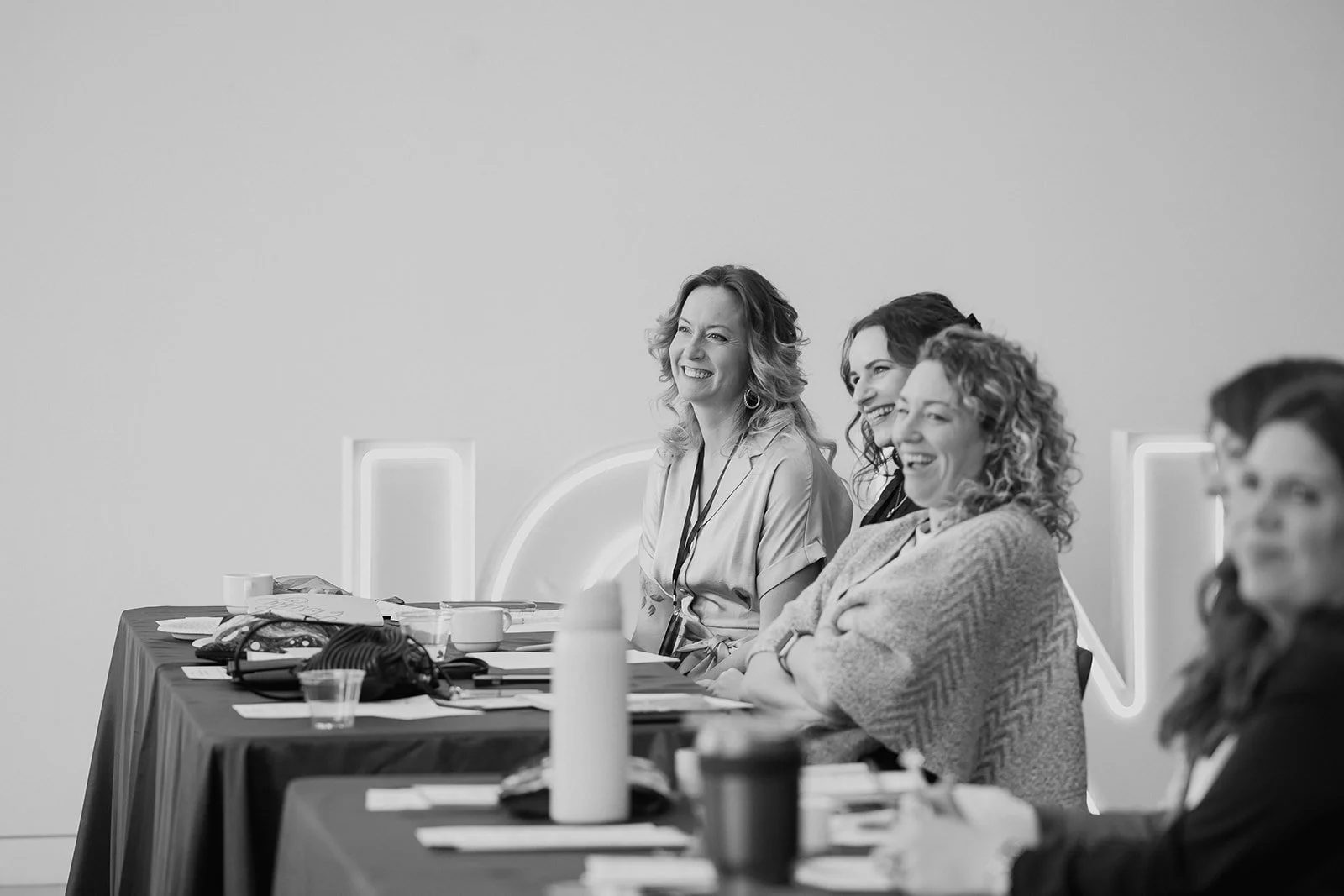 Wedding professionals listening during a Collective Vow conference session.