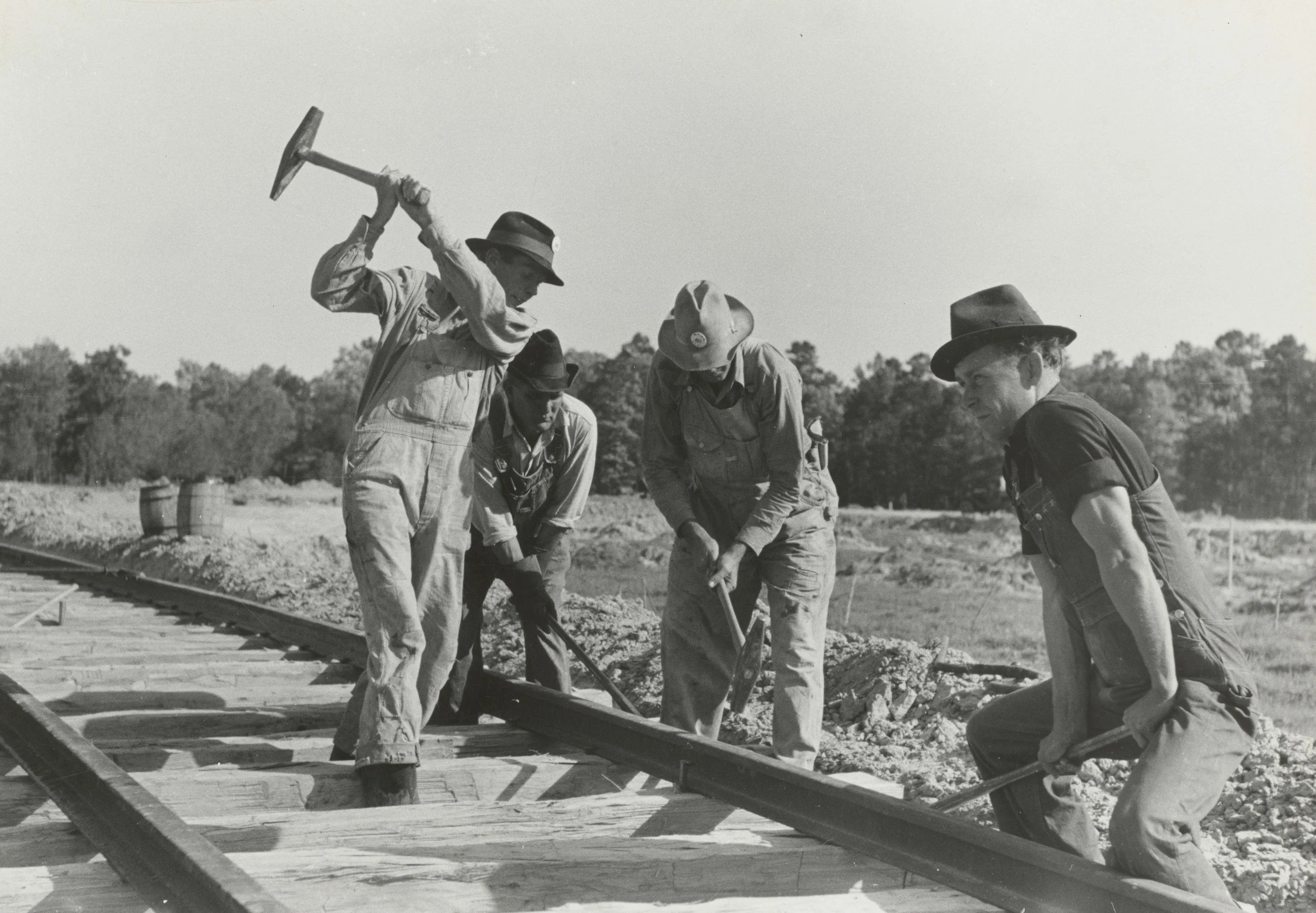 People working in the new America's building railway tracks, particularly during manifest destiny and the gold rush era.
