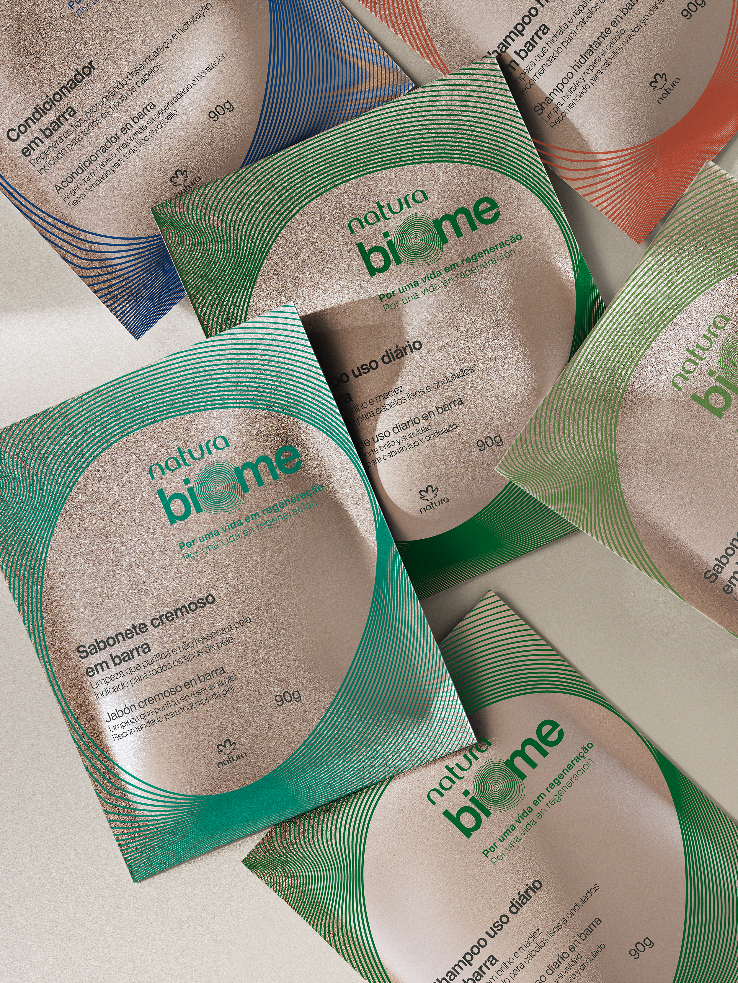 Bar soap packaging in green, blue, and red designs, featuring information on ingredients, daily usage instructions, a weight of 90g, and the Natura logo on each package.