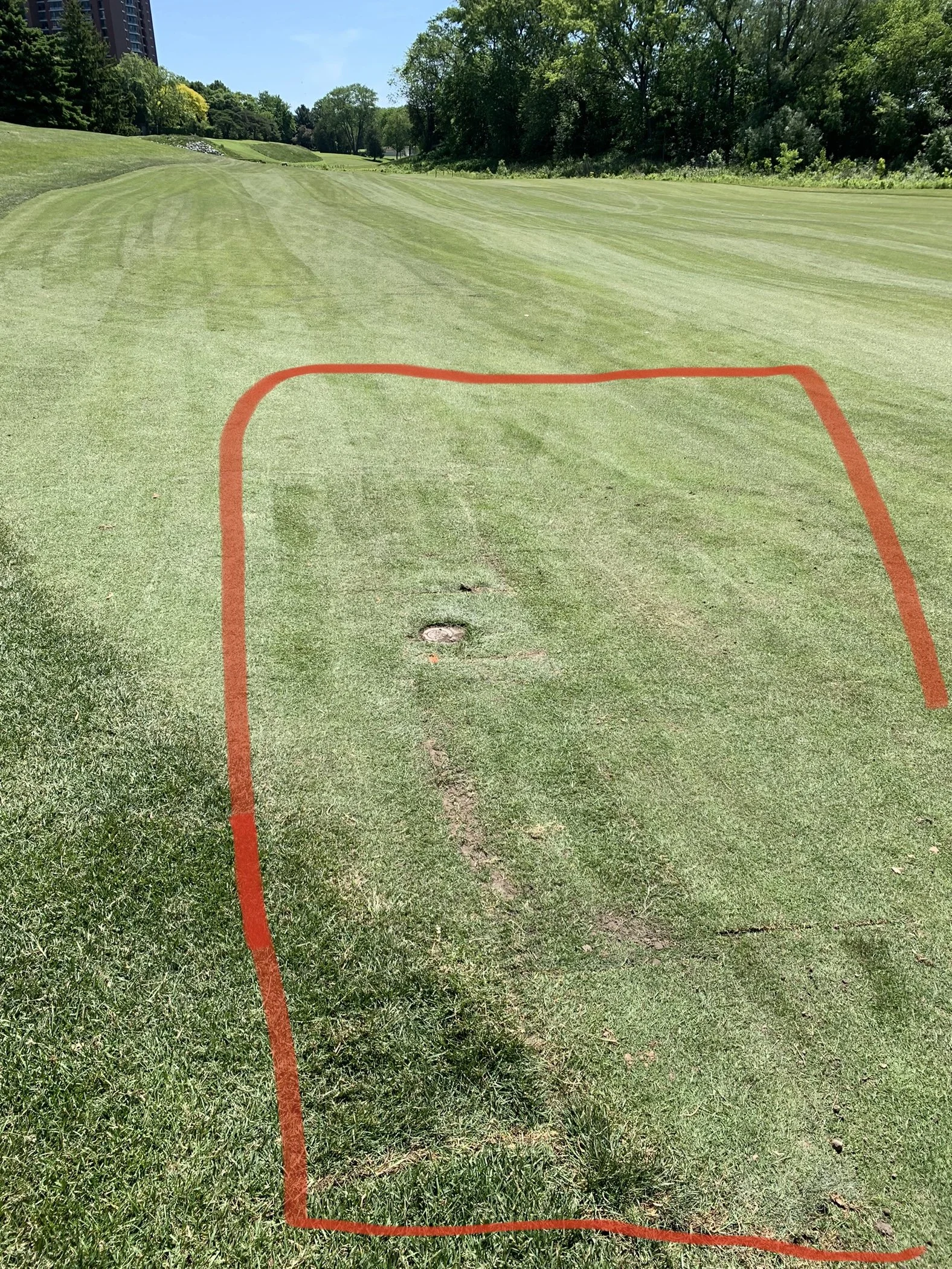 A golf course fairway with a red outline around the grass section, showing the area of interest.