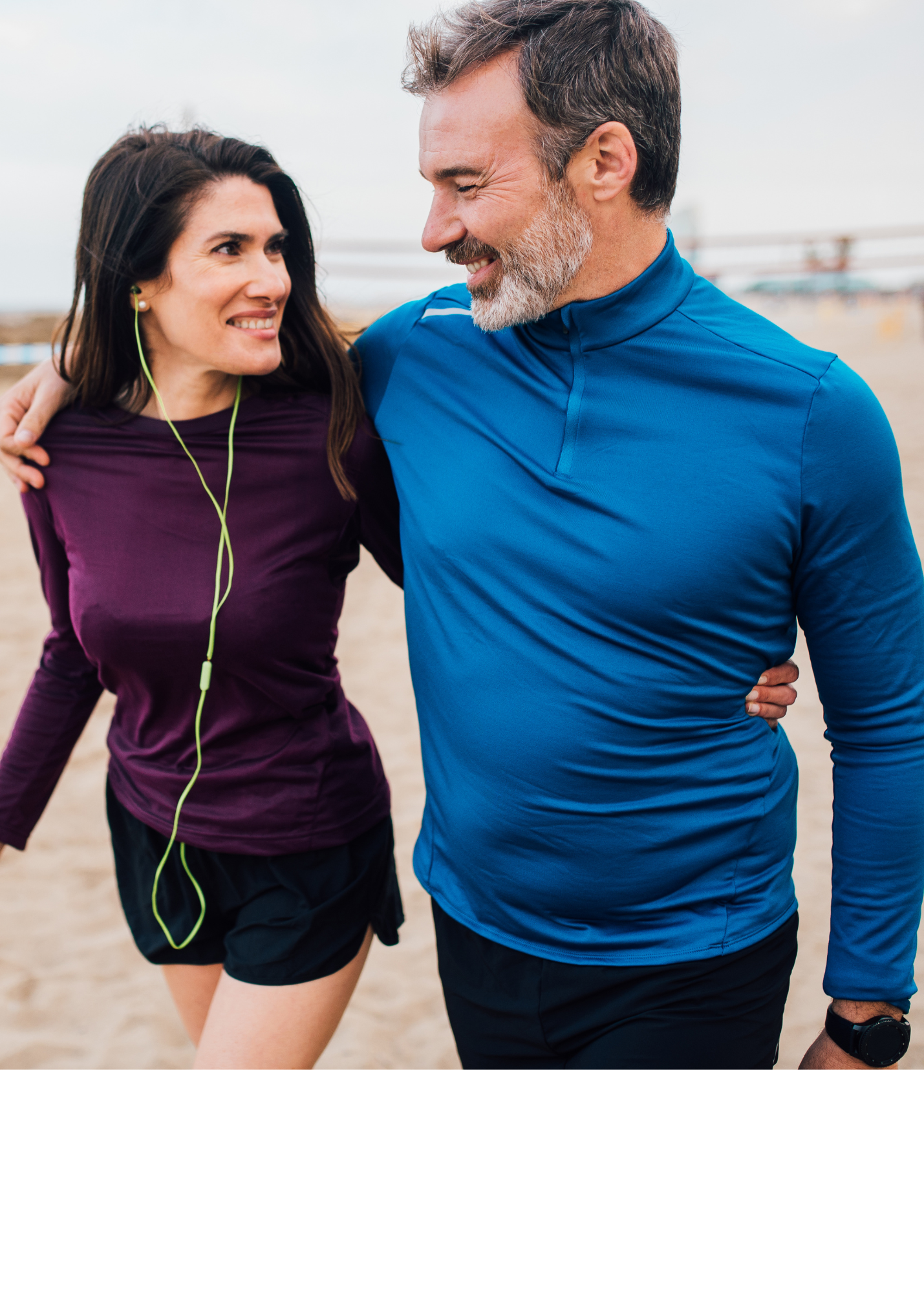 Man and Women walking with arms around each other
