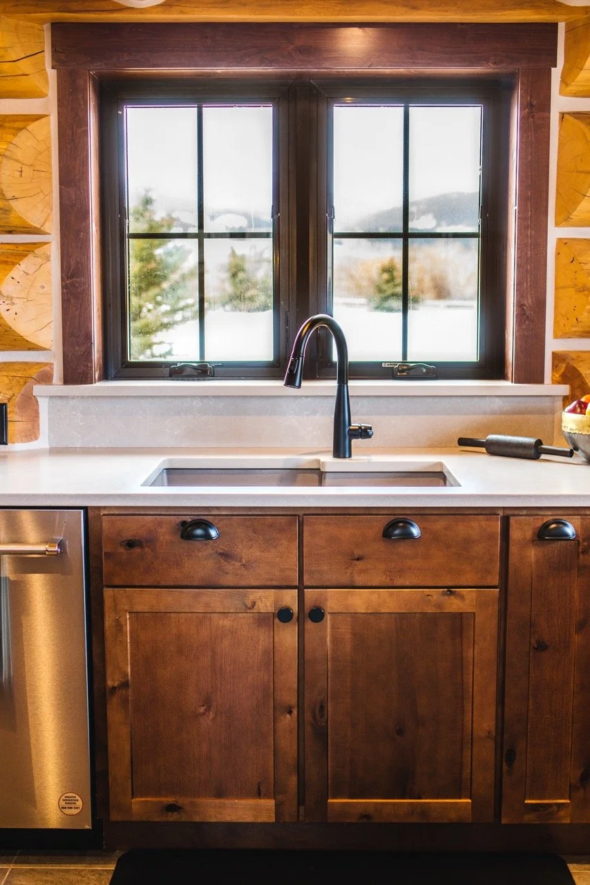 Log home kitchen, knotty alder cabinets, black matte faucet, mountain view - red lodge interior design, Designer Interiors