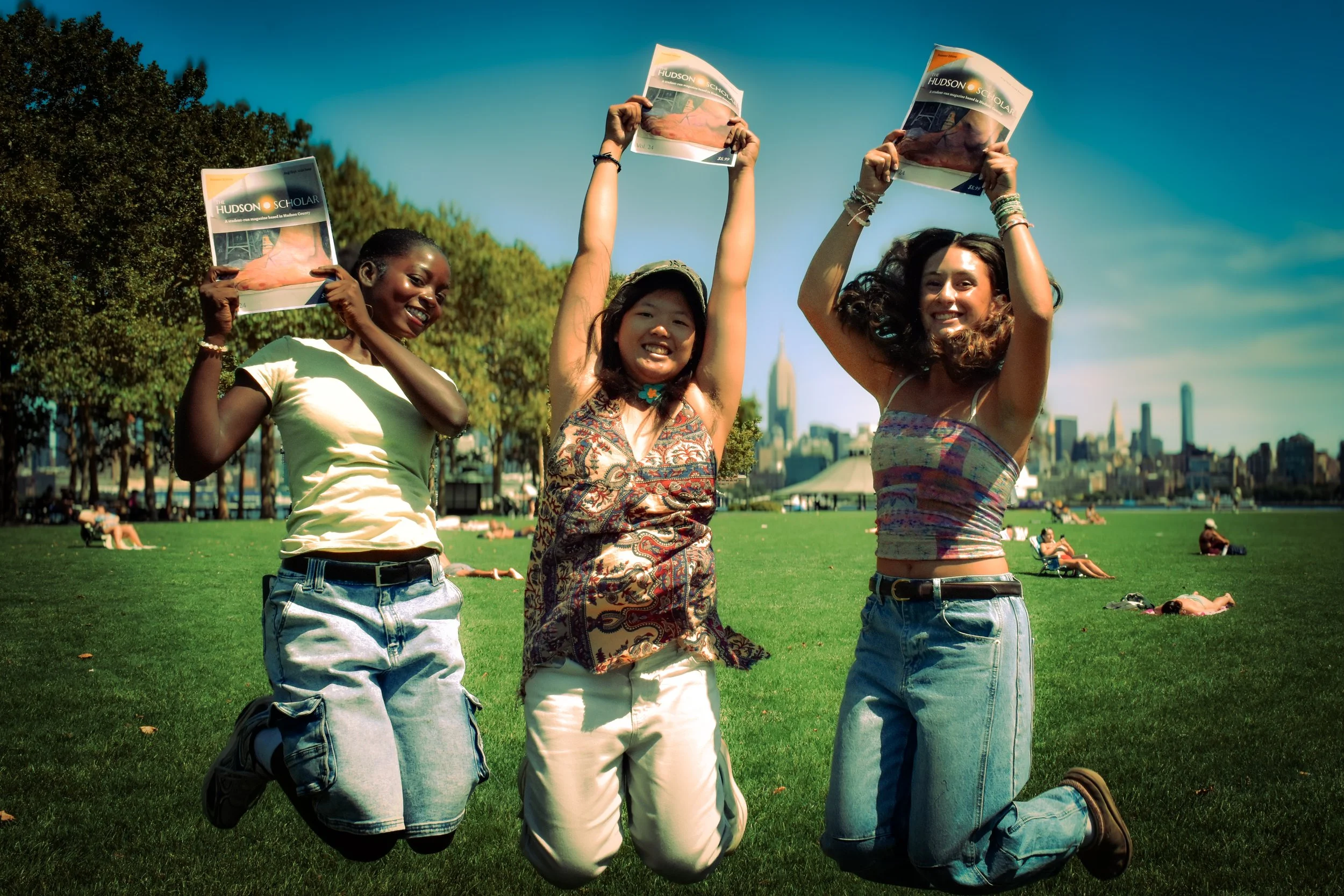 Apply to become part of Team Hudson Scholar. Members jumping up with the magazine at Pier A, Hoboken, New Jersey.