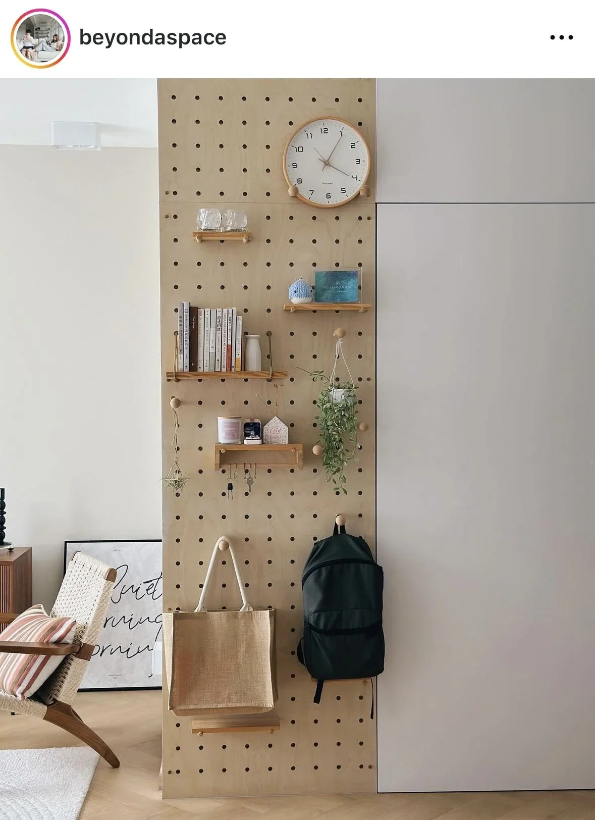 Functional entryway organization using a minimalist pegboard system by Refine Organizing.