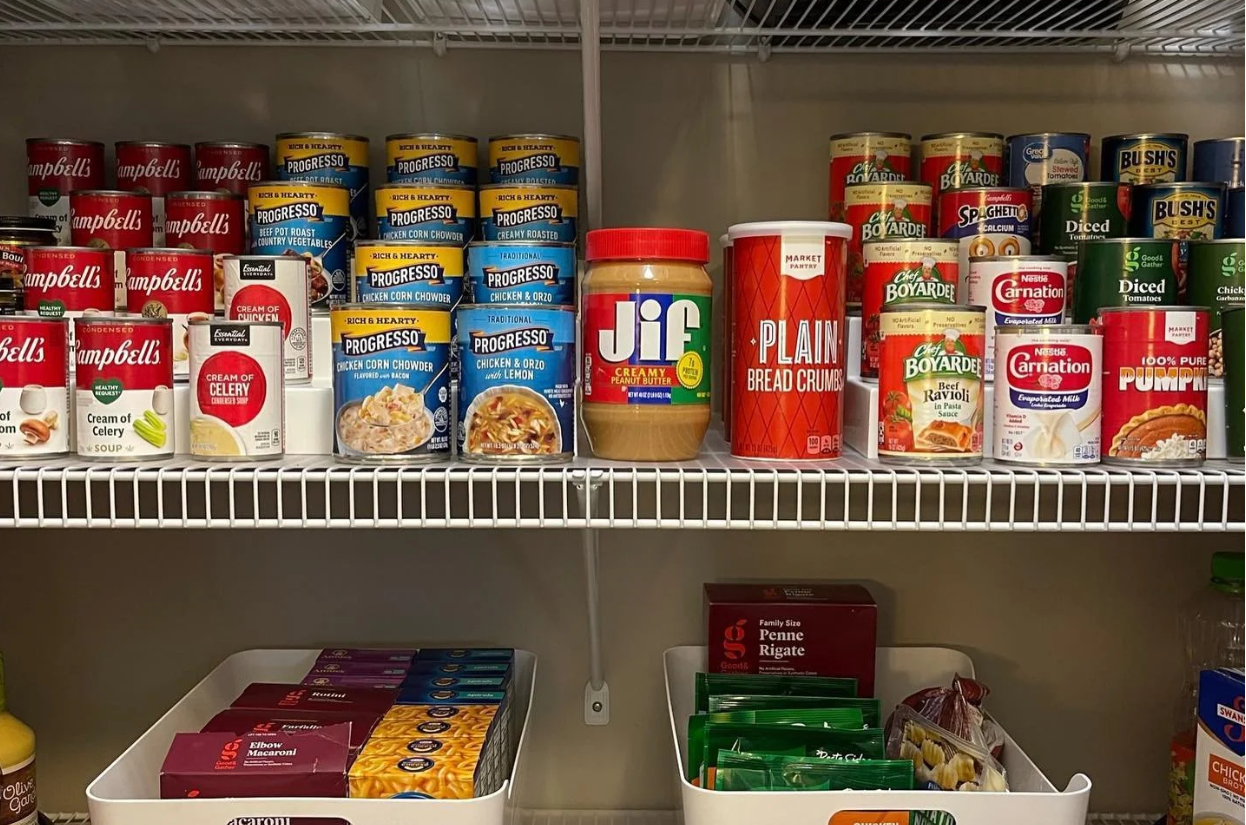 Professional pantry organization by Holli K Co. in Minneapolis, featuring neatly stacked canned goods and labeled bins for pasta.