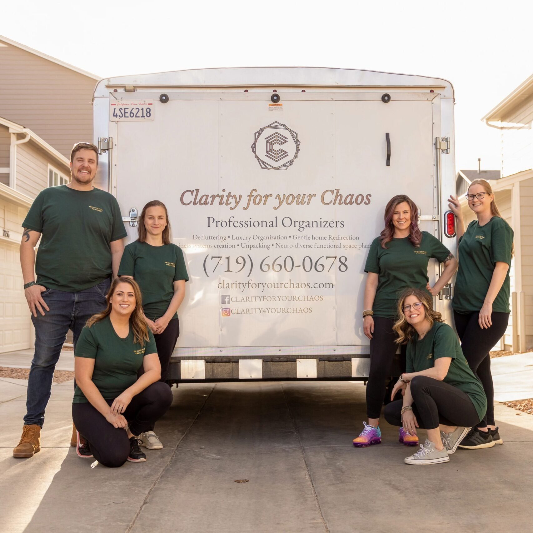 The Clarity for Your Chaos professional organizing team standing in front of their service trailer in Colorado Springs.