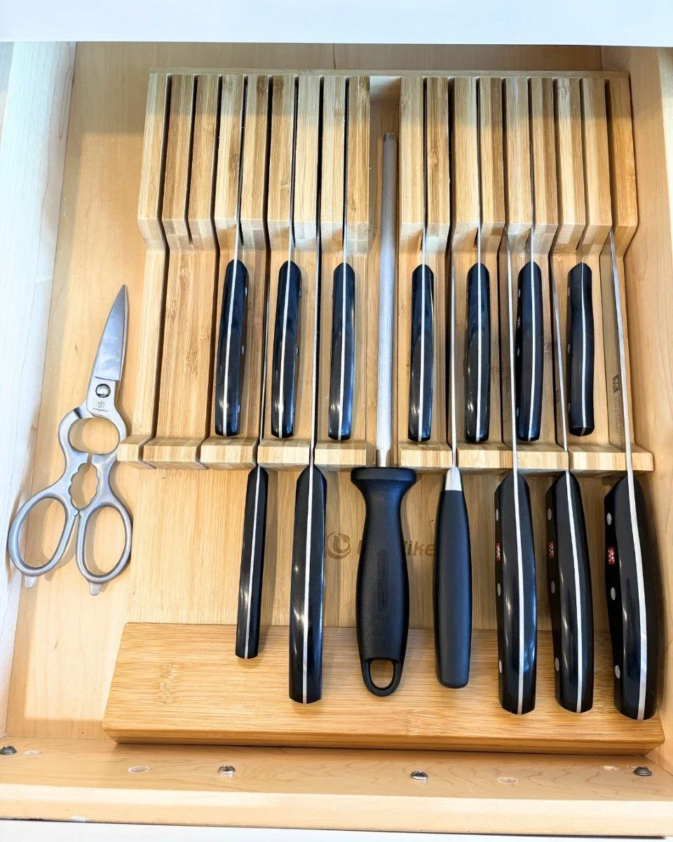 Organized kitchen drawer by Improved Spaces in Hartford County, CT, featuring a bamboo in-drawer knife block and professional cutlery.