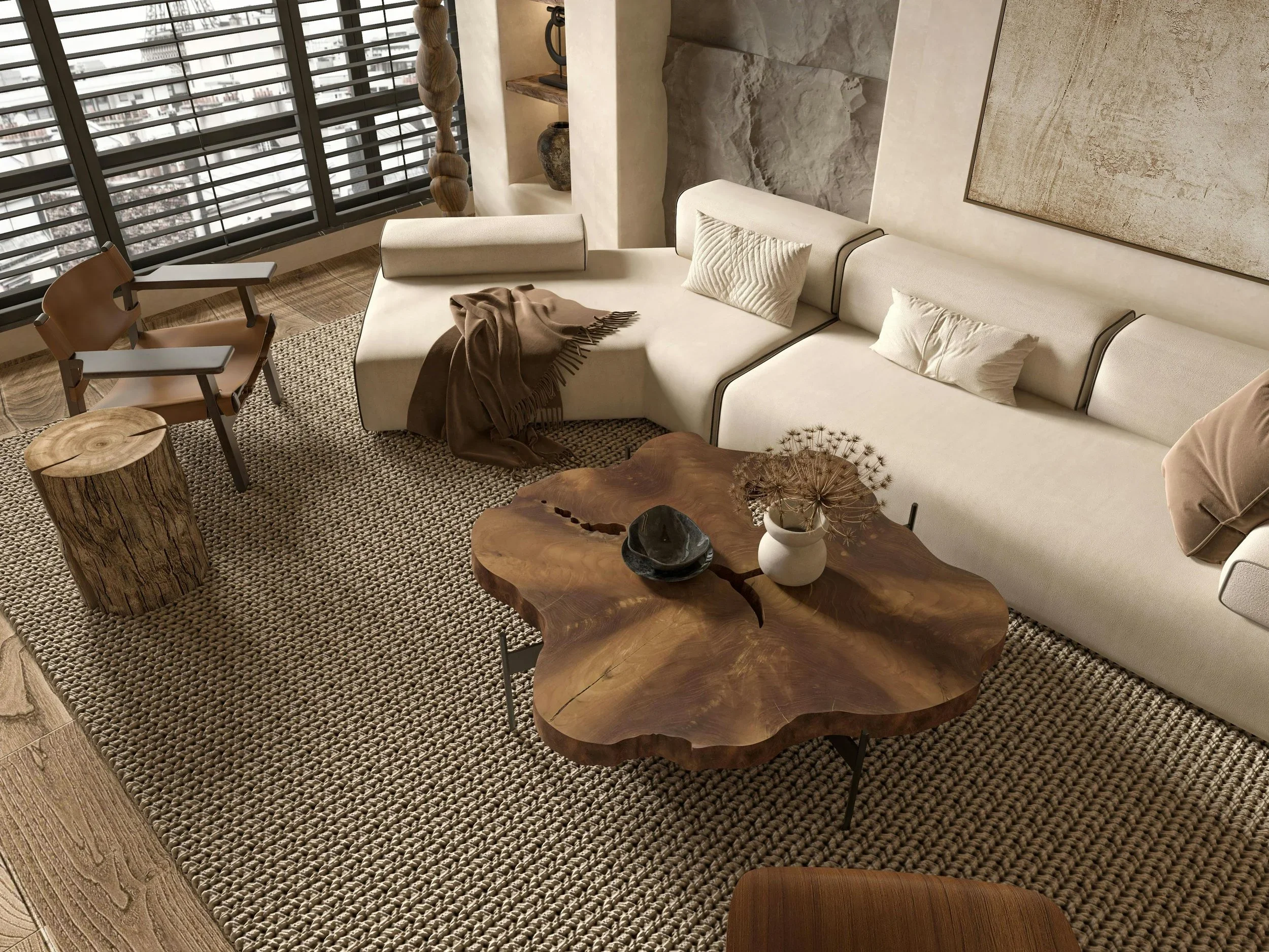A serene, minimalist living room styled by Michele Makes Space in Columbus, featuring a beige sectional, a unique live-edge wood coffee table, and a textured neutral rug.