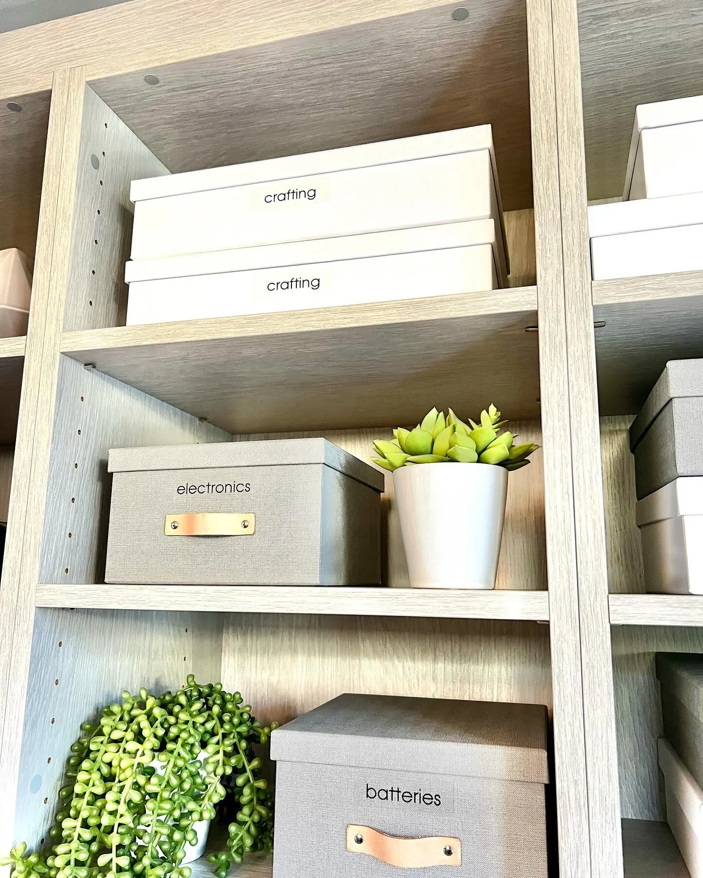 Professional shelf organization by North County Concierge in San Diego, featuring labeled bins for crafting and electronics.