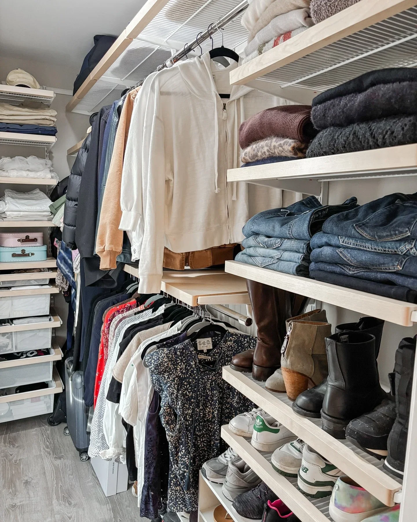 Professional closet organization by Orderly at the Shore in Jersey Shore, featuring neatly folded jeans, sweaters, and organized shoe shelving.