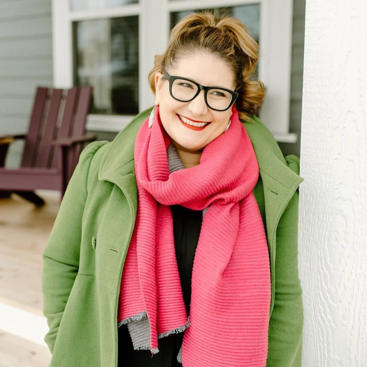 Pro Organizer Studio founder Jen Obermeier smiling in a green coat and pink scarf.
