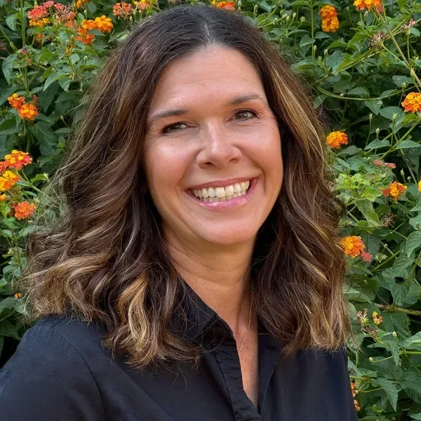 Laurie, professional organizer and owner of Delightfully Decluttered, smiling.