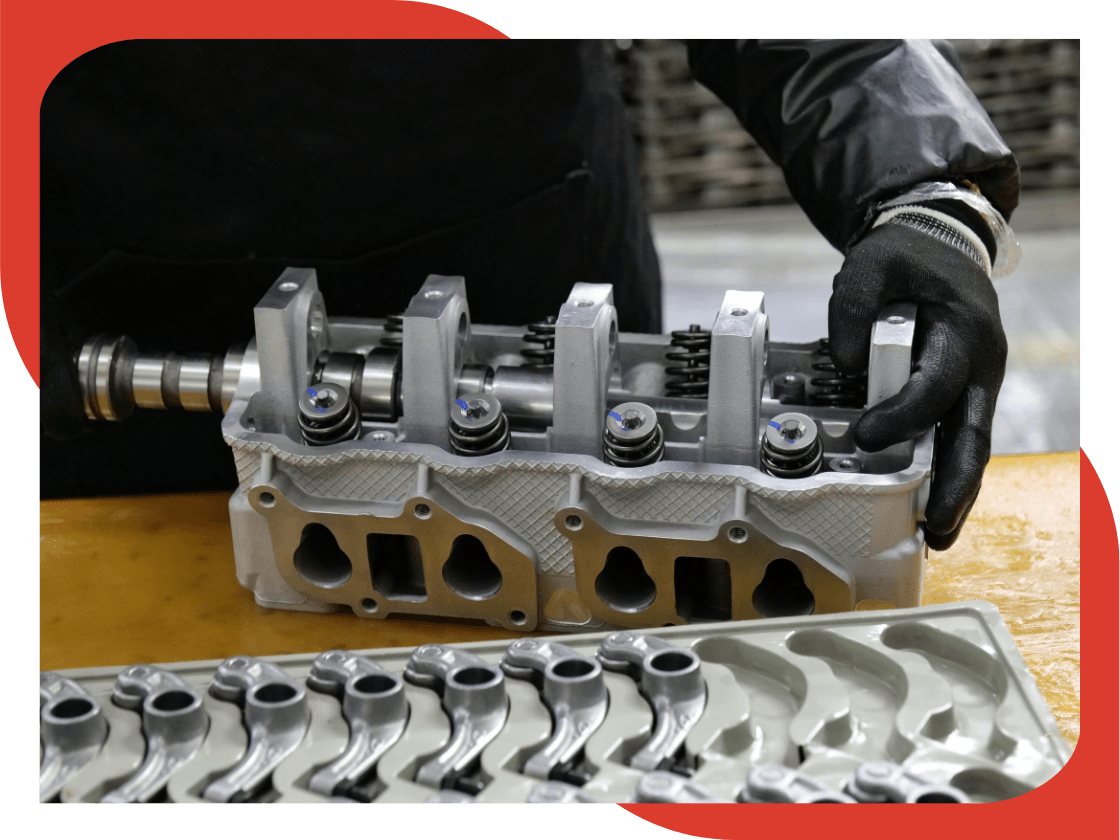 a mechanic assembling an engine