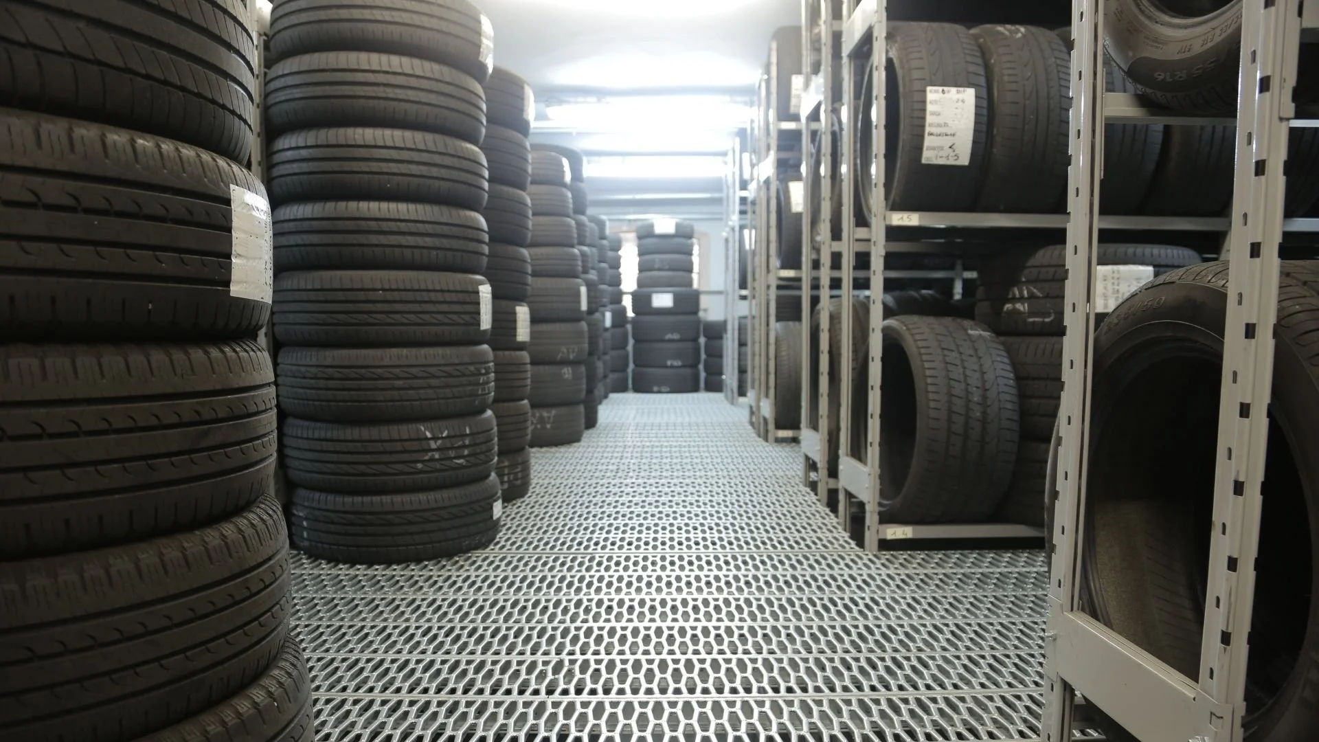 Stacks of tires in an auto shop.