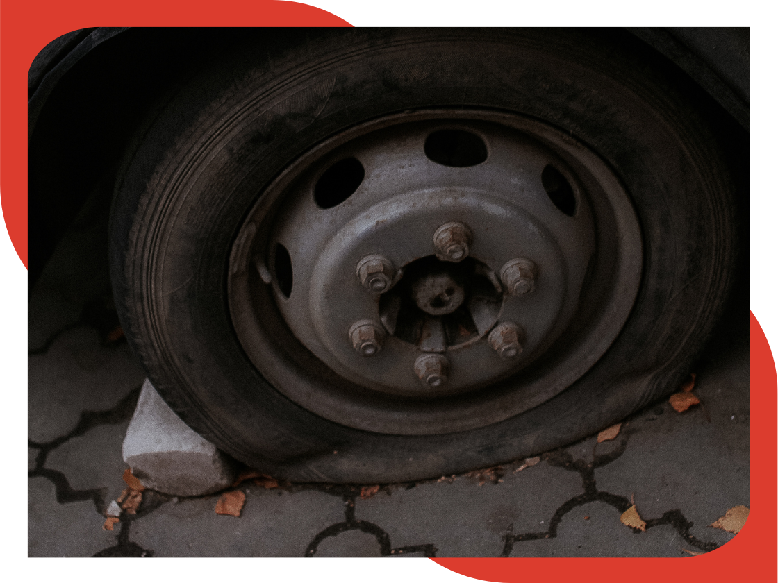 Flat tire on a car.