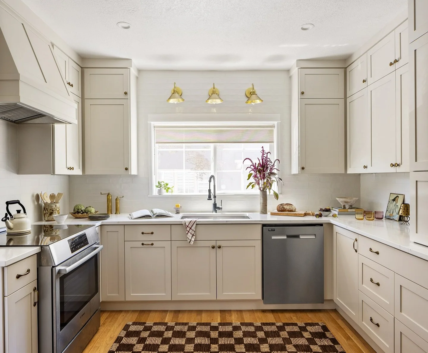 Before and after: the kitchen at our Grant Park project. Knowing that the footprint had to remain the same, we leaned into other changes that we knew would have a big impact. Taking the cabinetry and the beautiful tile backsplash all the way to the c
