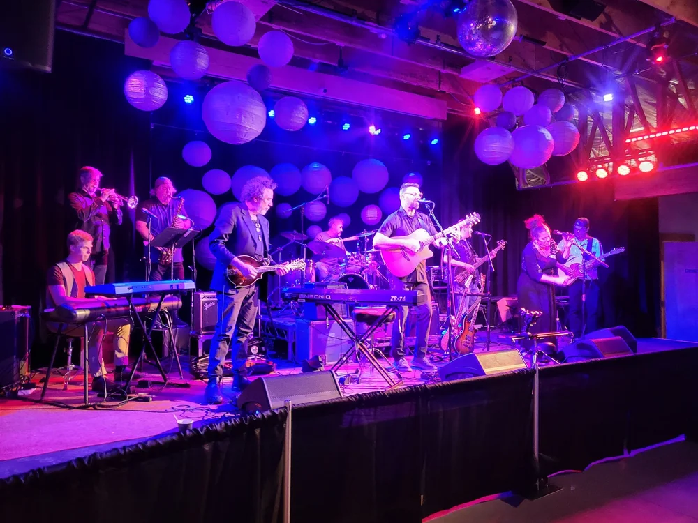 David Andrews Band performing under purple stage lights
