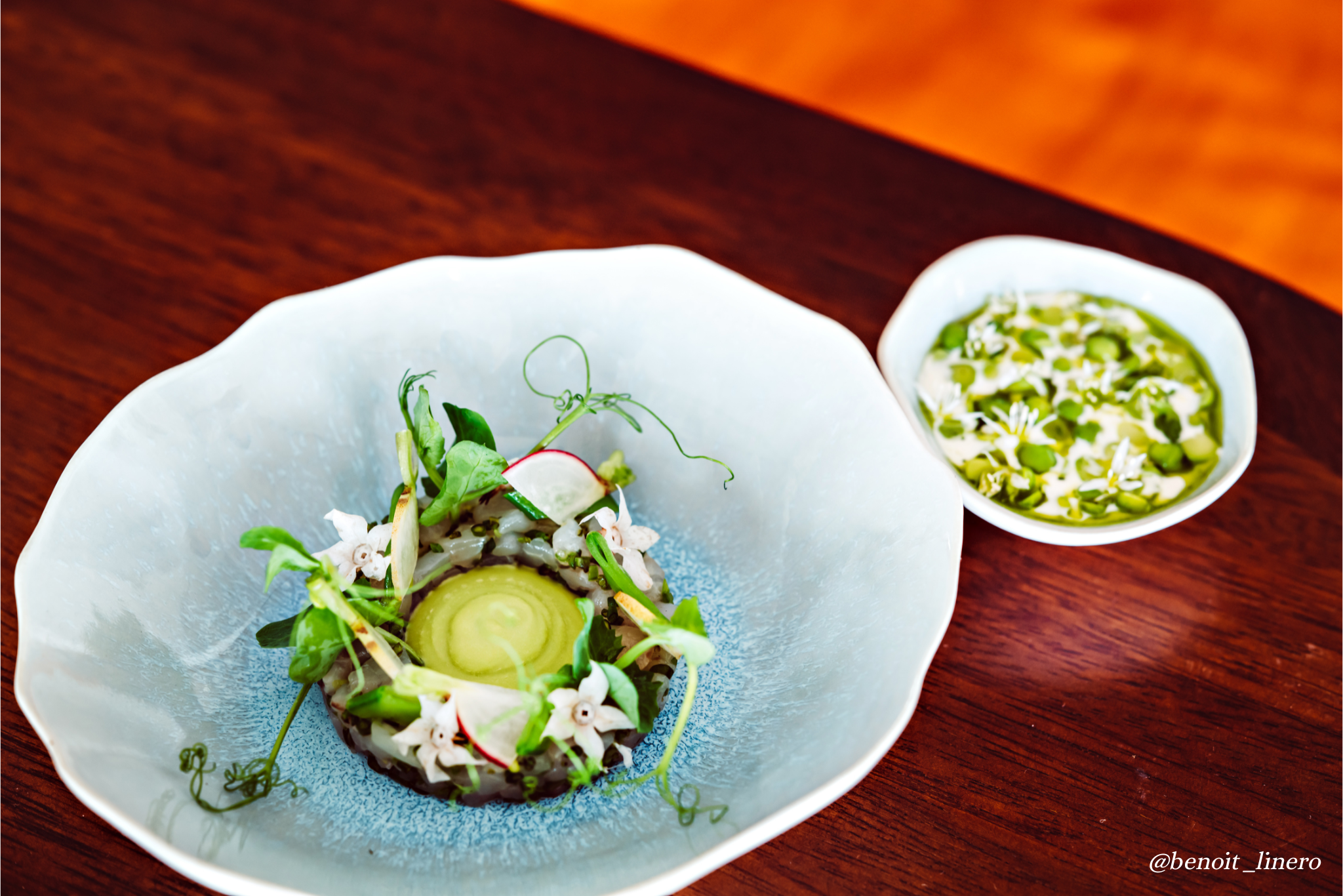 Seabass tartar with green peas and savory, one of our signature dish