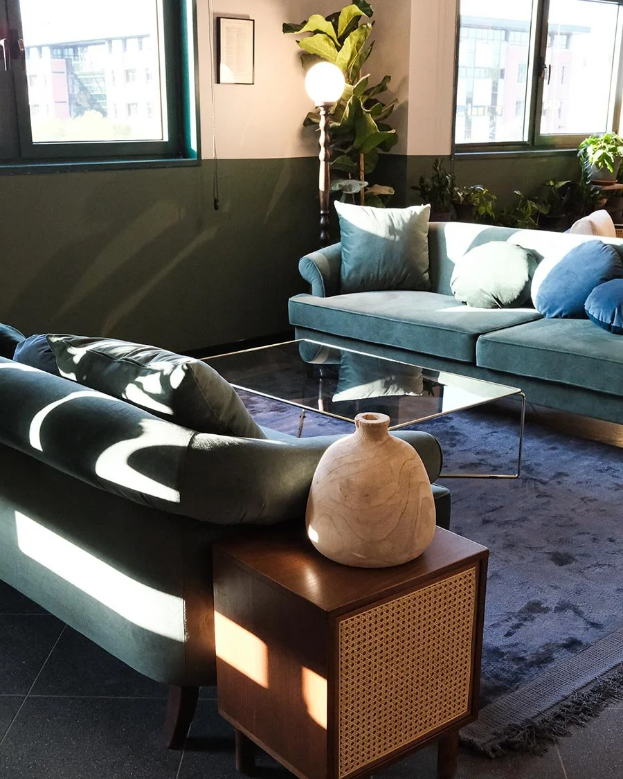 Photo of a lounge area with 2 couches and a coffee table