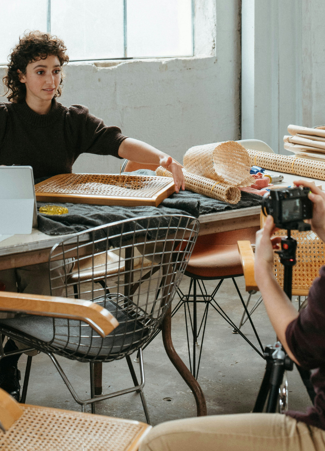 Photo of business owners creating content of items being repaired