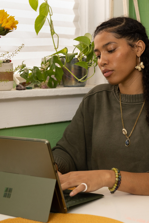 Photo of woman typing on her laptop