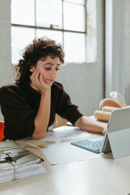 Photo of woman checking her email on her laptop