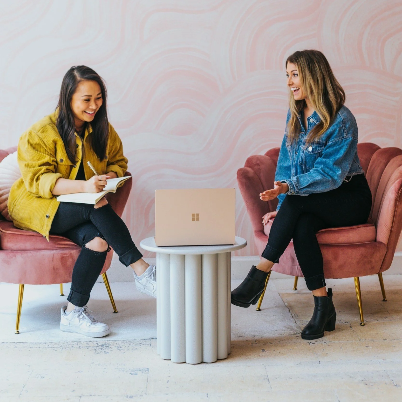 Two young adults sitting in pink chairs in OCD Therapy San Diego